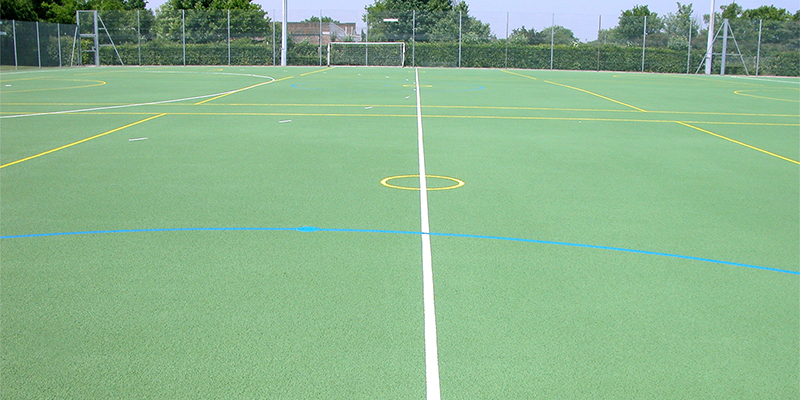Line marking paint for polymeric surfaces